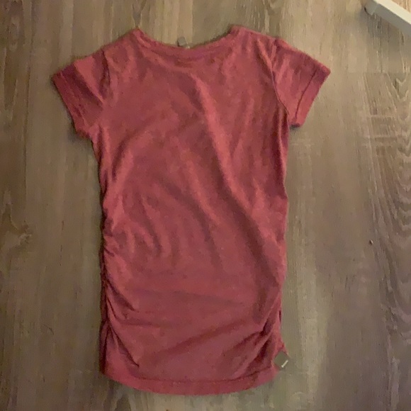 I’m selling a pink shirt for a kid that is 9 or 10yr with scrunched on sides - Picture 2 of 2